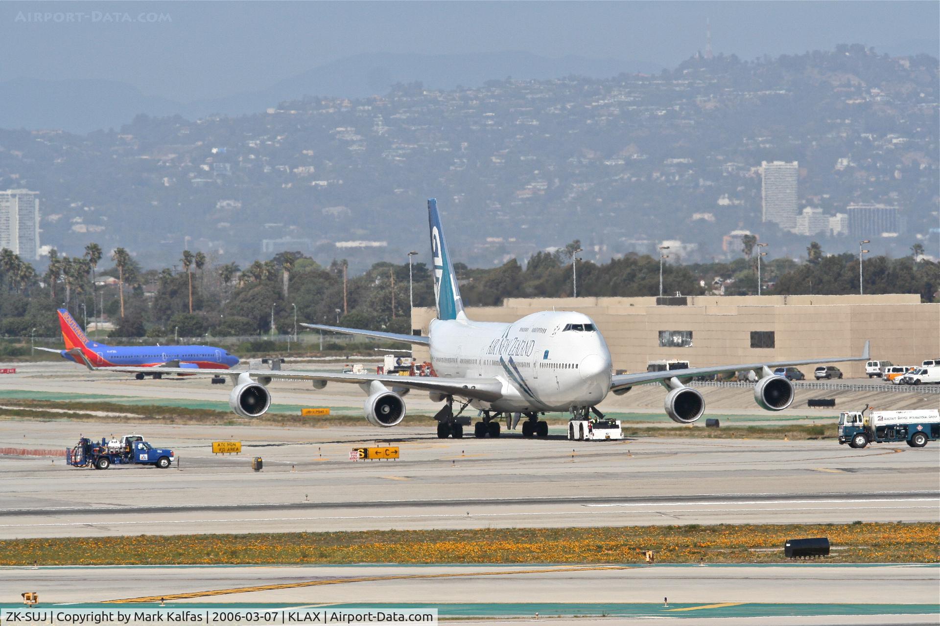 ZK-SUJ, 1998 Boeing 747-4F6 C/N 27602, Air New Zealand Boeing 747-4F6, getting a tow to the gate KLAX.