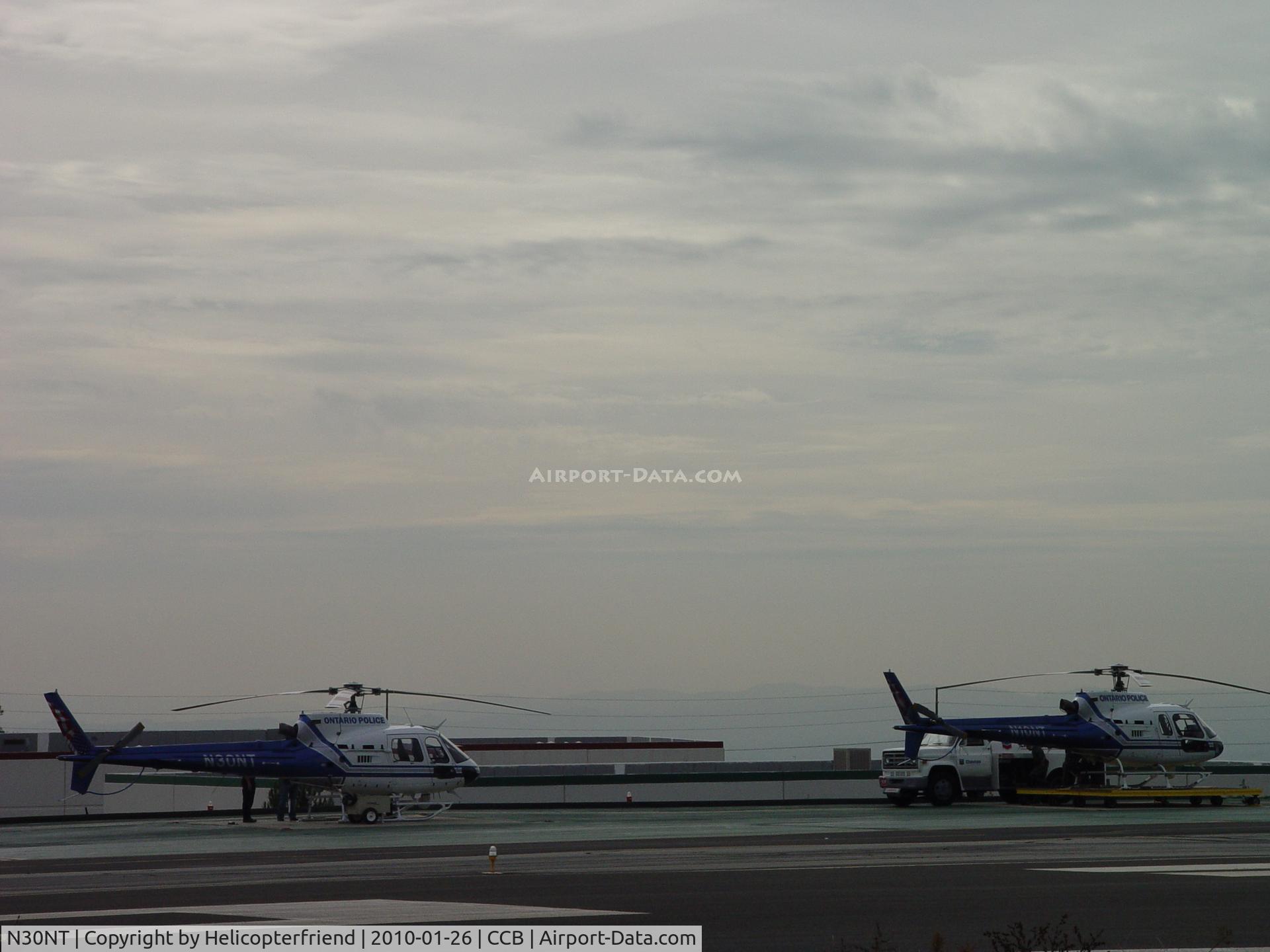 N30NT, 2007 Eurocopter AS-350B-2 Ecureuil C/N 4352, N30NT being checled out, N10NT be refueled