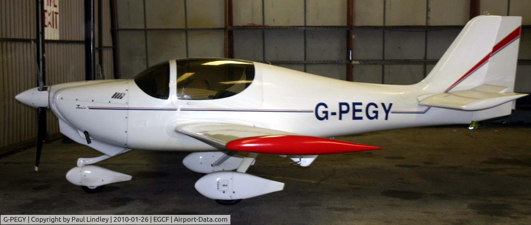 G-PEGY, 2000 Europa Tri-Gear C/N PFA 247-12713, quiet in the hanger.