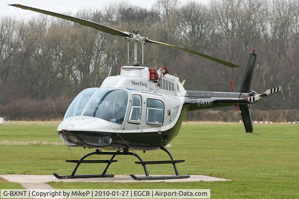 G-BXNT, 1977 Bell 206B JetRanger III C/N 2398, Parked up on a grey Manchester day.