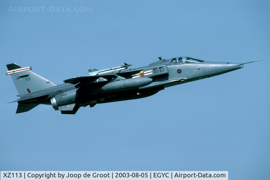 XZ113, 1976 Sepecat Jaguar GR.3 C/N S.114, The classic take off shot of a Jaguar: fast and low over the barrier at the runways end. This one is fitted with the overwing sidewinders.