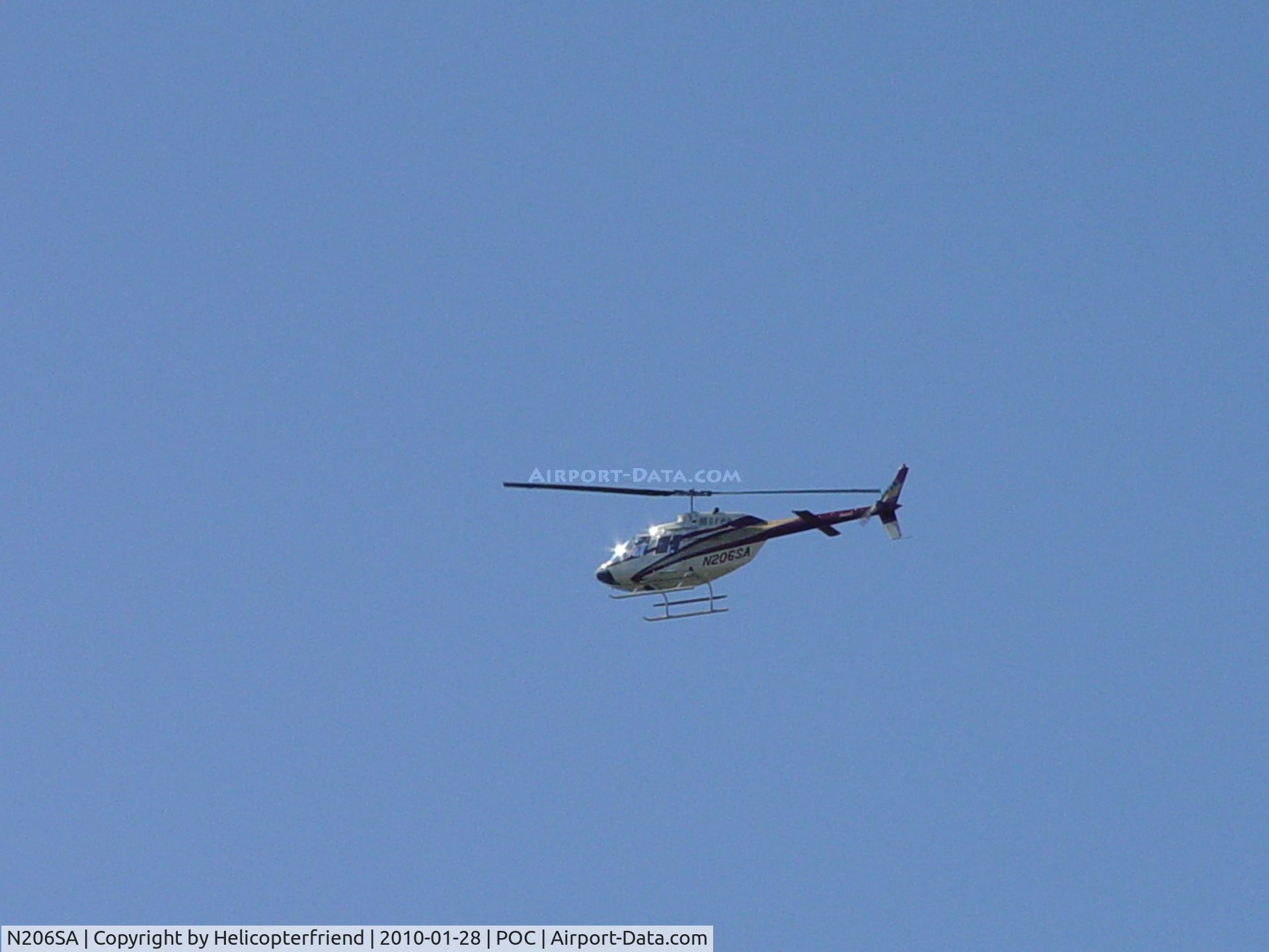 N206SA, 1973 Bell 206B JetRanger II C/N 1013, Crossing active runway for downwind leg to Brackett eastside helipad