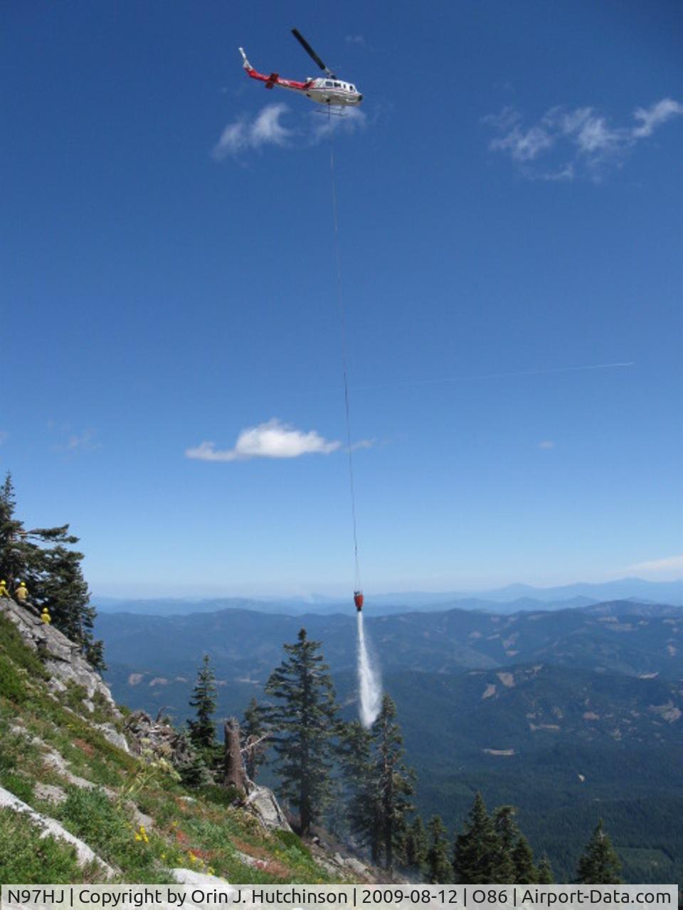 N97HJ, 1974 Bell 205A-1 C/N 30173, N97HJ doing bucket drops on a fire in Trinity Alps Wilderness in Northern California