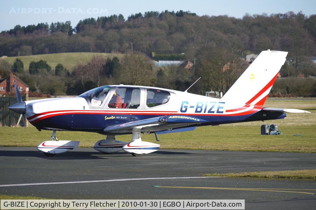G-BIZE, 1981 Socata TB-9 Tampico C/N 209, Part of a busy aviation scene at Wolverhampton (Halfpenny Green) Airport on a crisp winters day