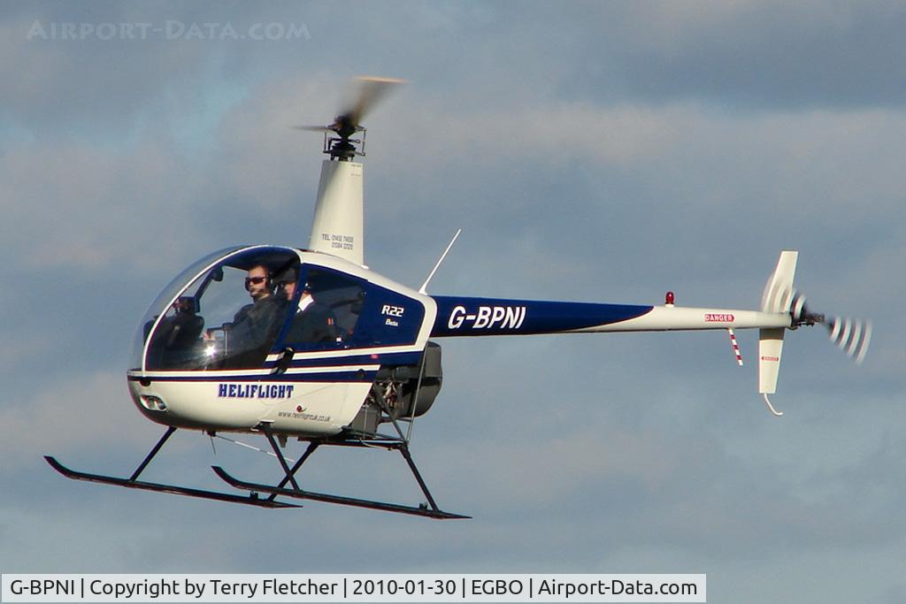G-BPNI, 1989 Robinson R22 Beta C/N 0948, Part of a busy aviation scene at Wolverhampton (Halfpenny Green) Airport on a crisp winters day