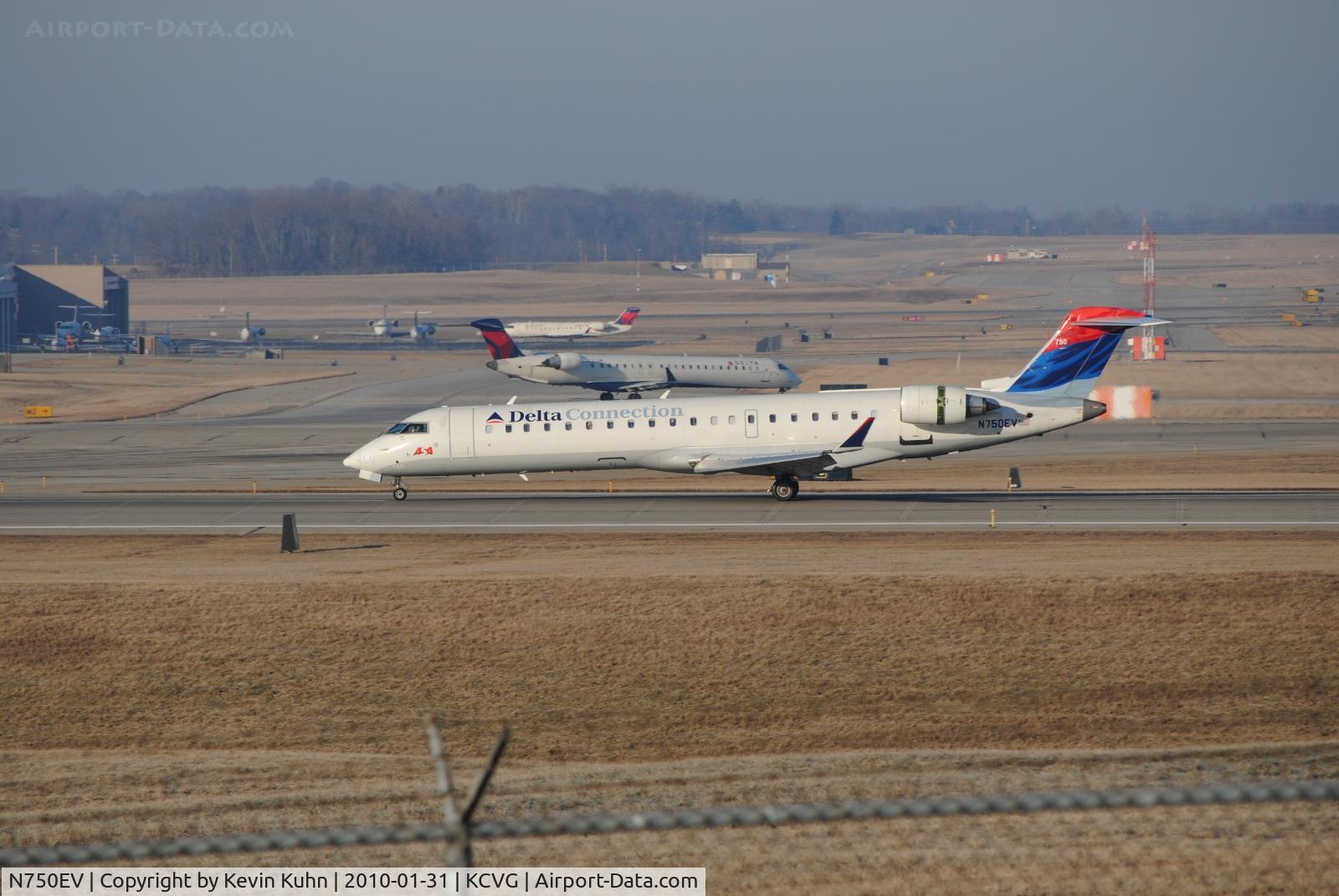 N750EV, 2004 Bombardier CRJ-701 (CL-600-2C10) Regional Jet C/N 10161, Acey rolling in bathed in morning sunlight