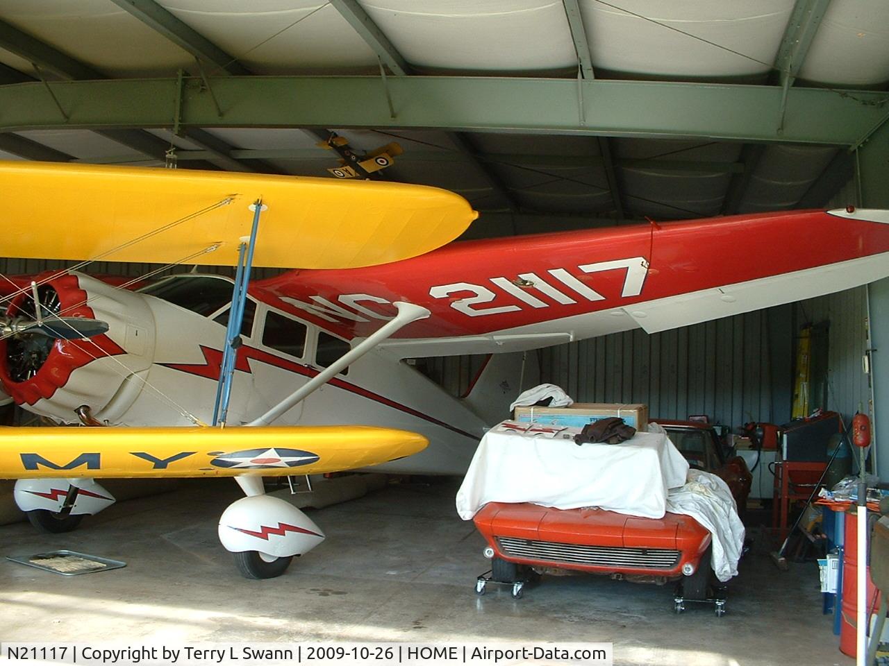 N21117, 1939 Stinson SR-9C Reliant C/N 5371, In the hanger with the other Stinson, Stearman and Corvette.