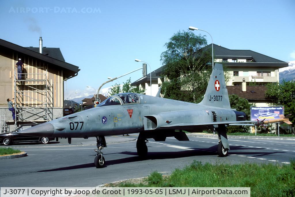 J-3077, Northrop F-5E Tiger II C/N L.1077, This is the strangest picture I've ever taken: a Tiger rolls through the village of Turtmann while the traffic on the main street is halted by traffic lights and soldiers.