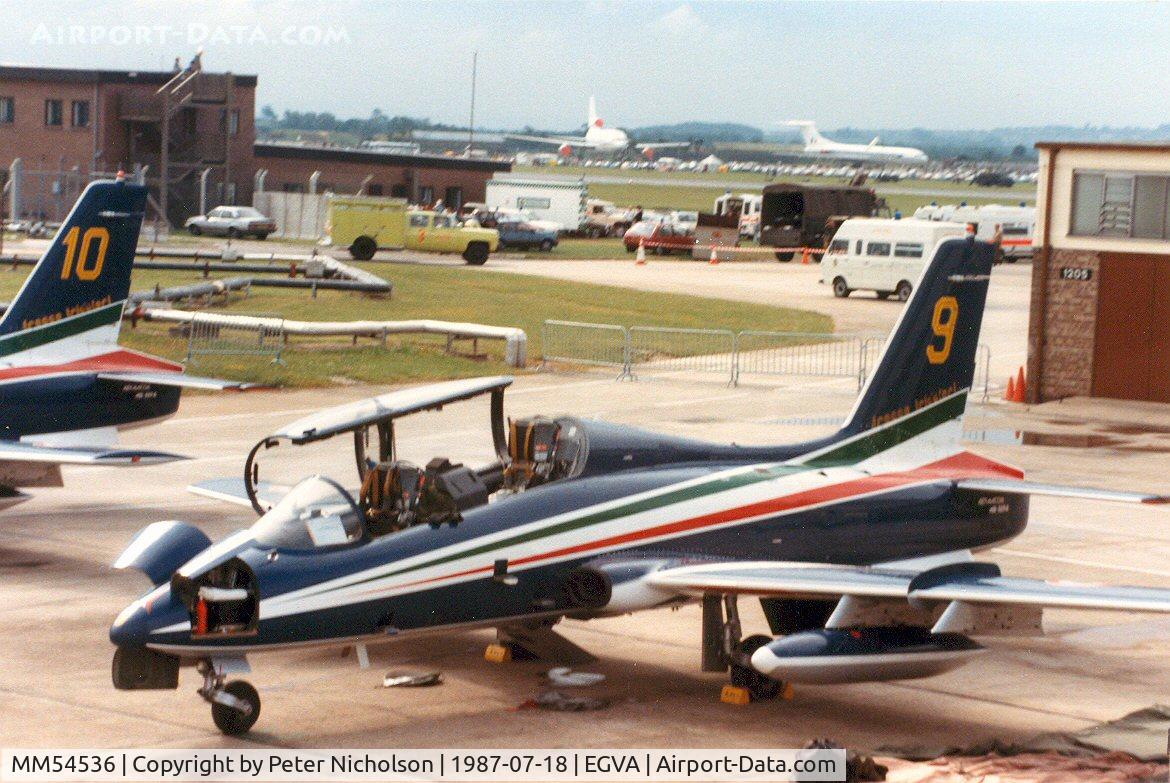 MM54536, Aermacchi MB-339A C/N 6743/138/AD016, MB339A number 9 of the Italian Air Force's Frecce Tricolori display team on the flight-line at the 1987 Intnl Air Tattoo at RAF Fairford.