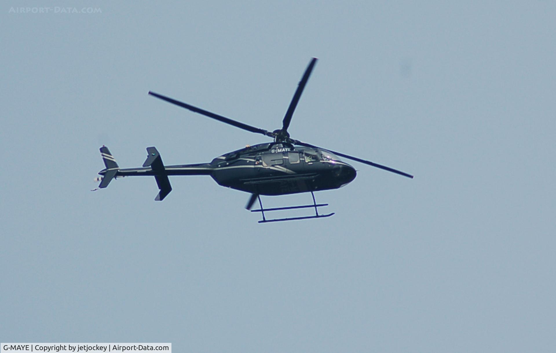 G-MAYE, 1997 Bell 407 C/N 53117, Passing over the house