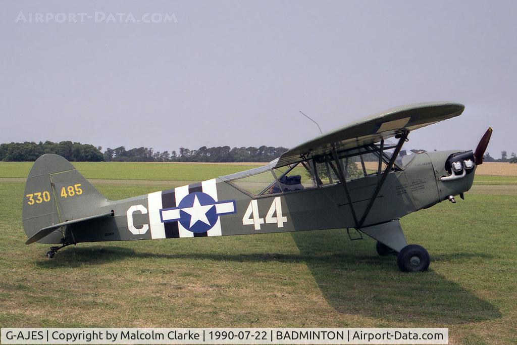 G-AJES, 1943 Piper L-4J Grasshopper (J3C-65D) C/N 11602, Piper L-4J Grasshopper (J-3C-65D)  at Badminton Air Day held at Badminton House in 1990
