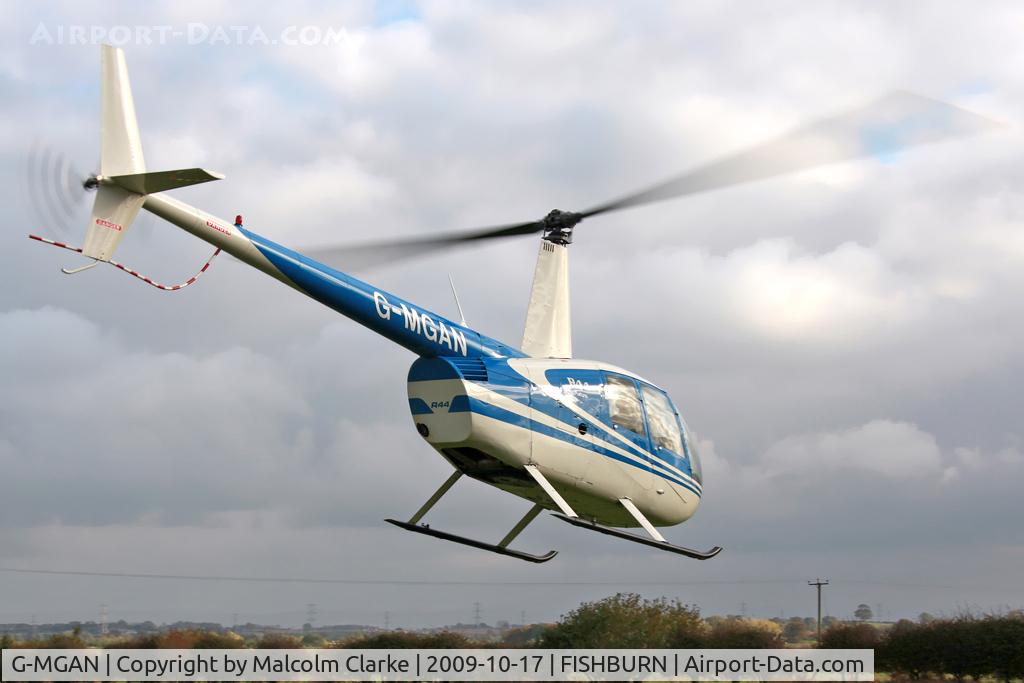 G-MGAN, 1999 Robinson R44 C/N 0588, Robinson R-44 at Fishburn Airfield, UK in 2009.