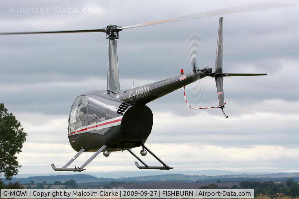 G-MGWI, 2000 Robinson R44 Astro C/N 0663, Robinson R-44 Astro at Fishburn Airfield in 2009.