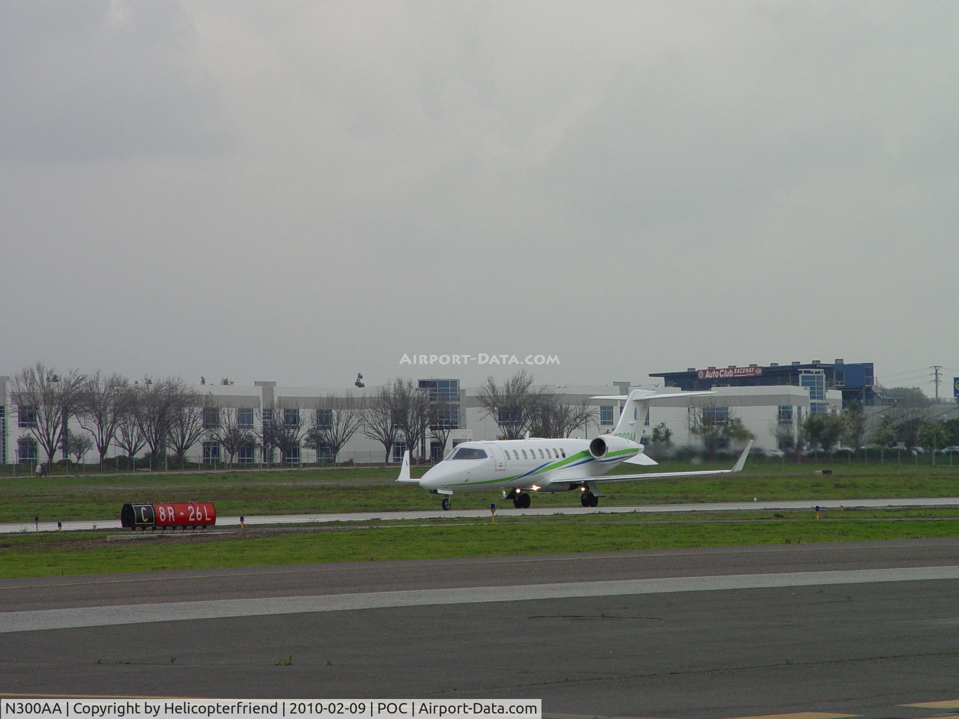 N300AA, 2005 Learjet 45 C/N 45-285, Rolling westbound on runway 26L preparing for liftoff