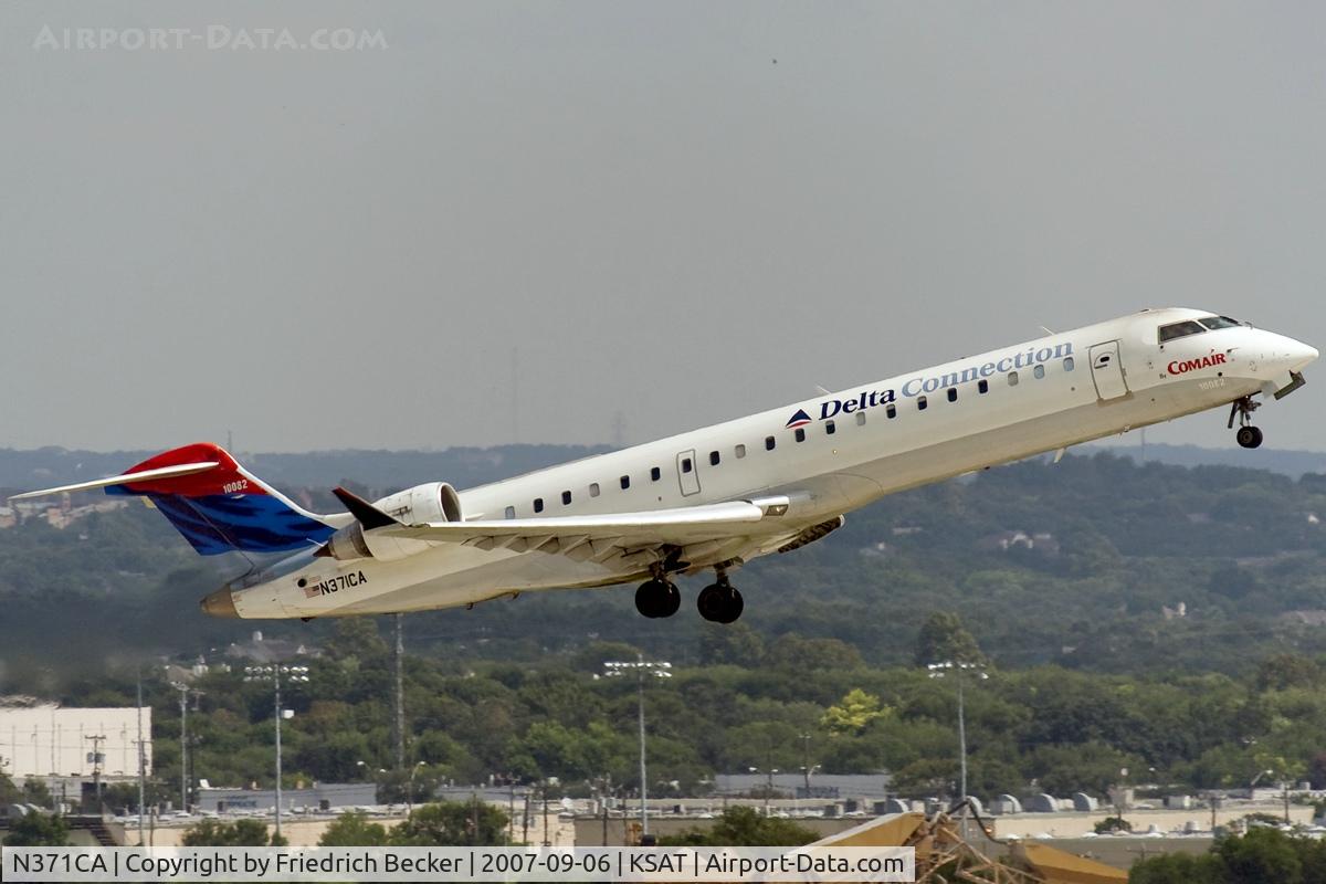 N371CA, 2003 Bombardier CRJ-701ER (CL-600-2C10) Regional Jet C/N 10082, departing KSAT