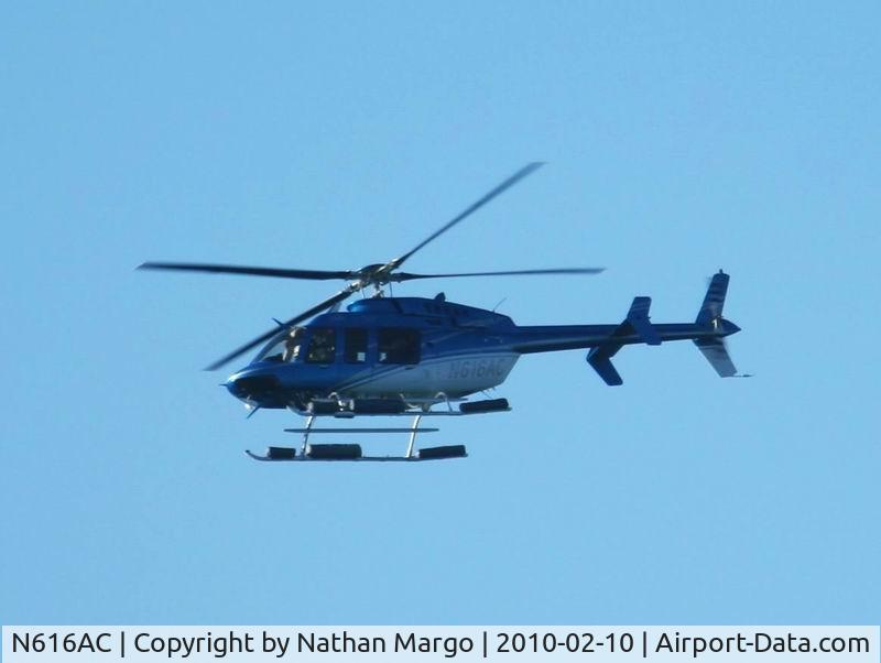 N616AC, 1999 Bell 407 C/N 53354, Seen flying over Sunset Cliffs, San Diego, CA.
