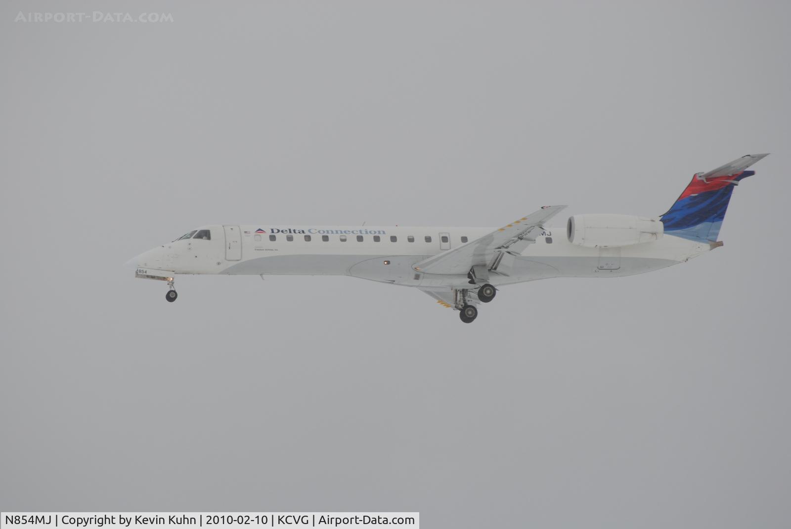 N854MJ, 2002 Embraer ERJ-145LR (EMB-145LR) C/N 145490, Freedom Air on final, during a winter storm