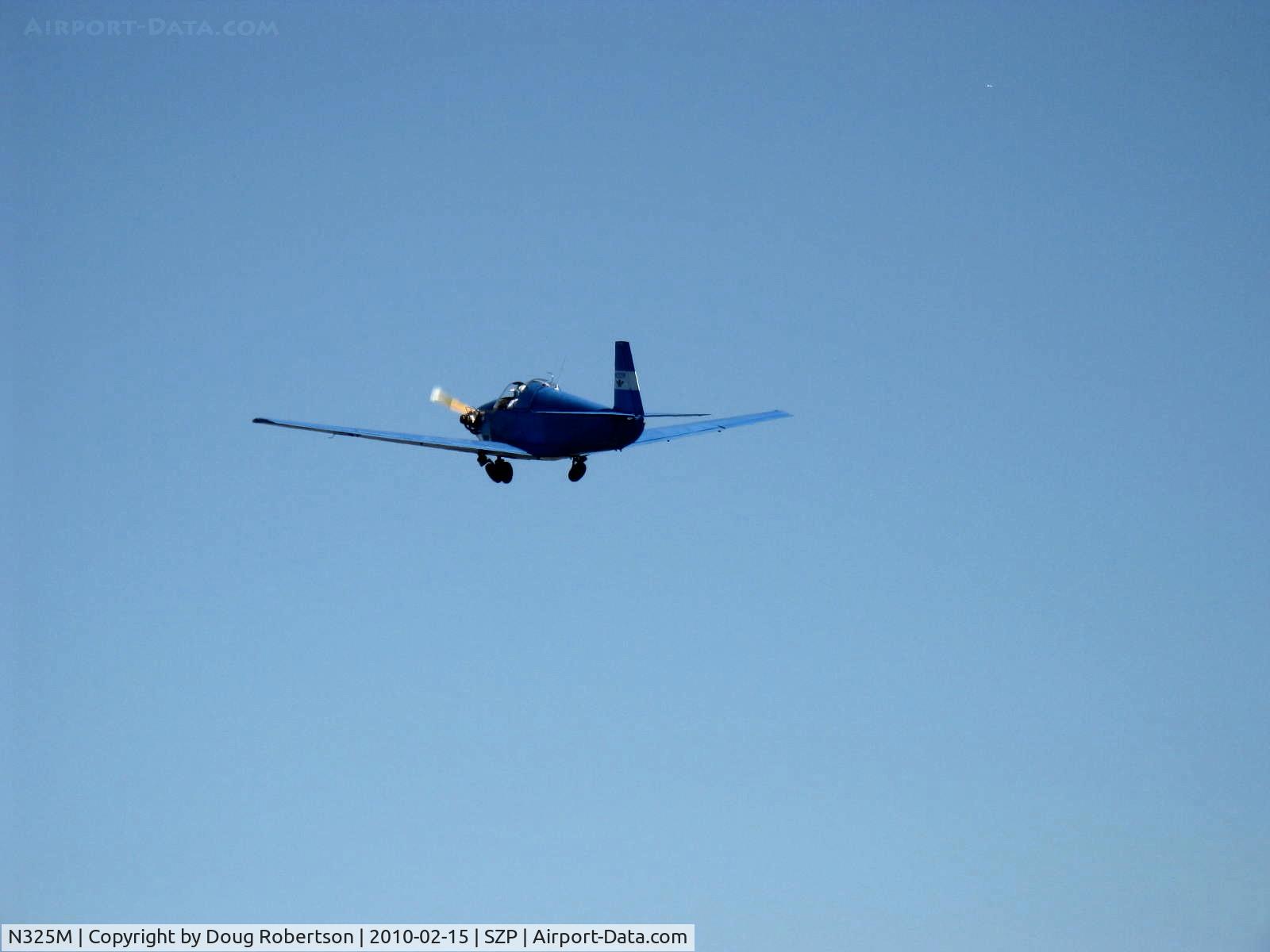 N325M, 1950 Mooney M-18C C/N 206, 1950 Mooney M-18C MITE, Continemntal A&C65 65 Hp, takeoff climb Rwy 04. Manual gear coming up. My thanks to Nick Taylor of C-140 N72922 for the quick N number ID.
