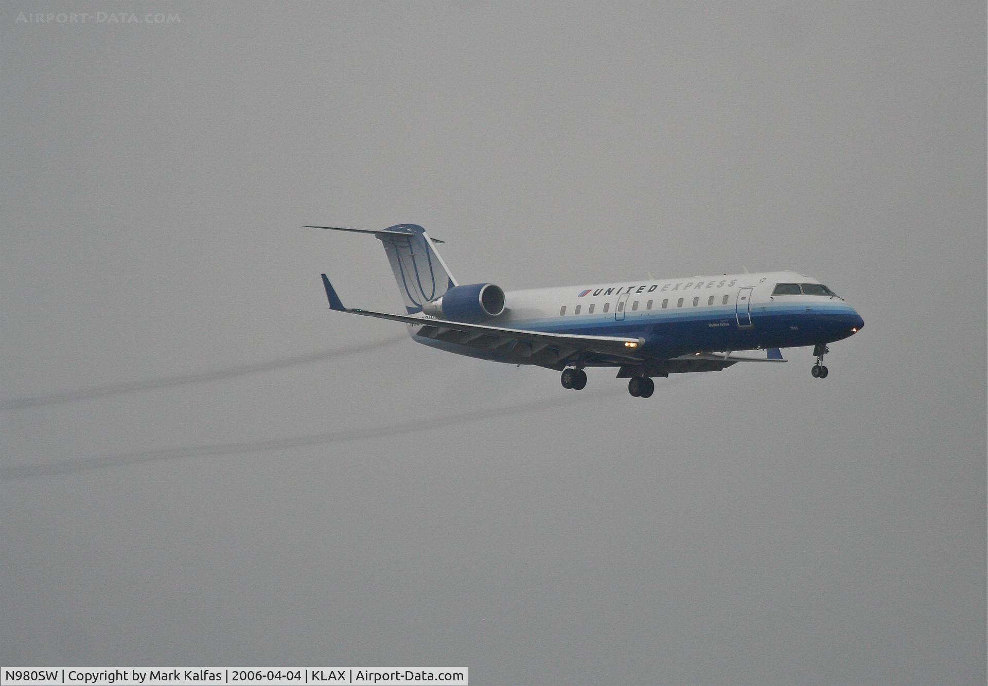 N980SW, 2004 Bombardier CRJ-200ER (CL-600-2B19) C/N 7955, SkyWest Bombardier CL-600-2B19, 7R approach in WX KLAX.