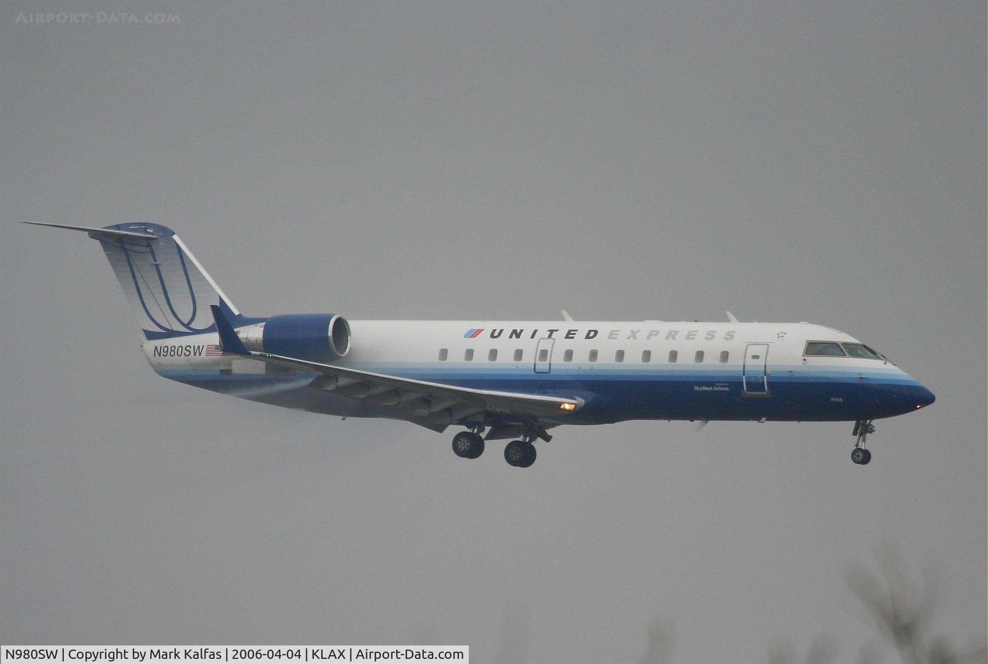 N980SW, 2004 Bombardier CRJ-200ER (CL-600-2B19) C/N 7955, SkyWest Bombardier CL-600-2B19, 7R approach in WX KLAX.