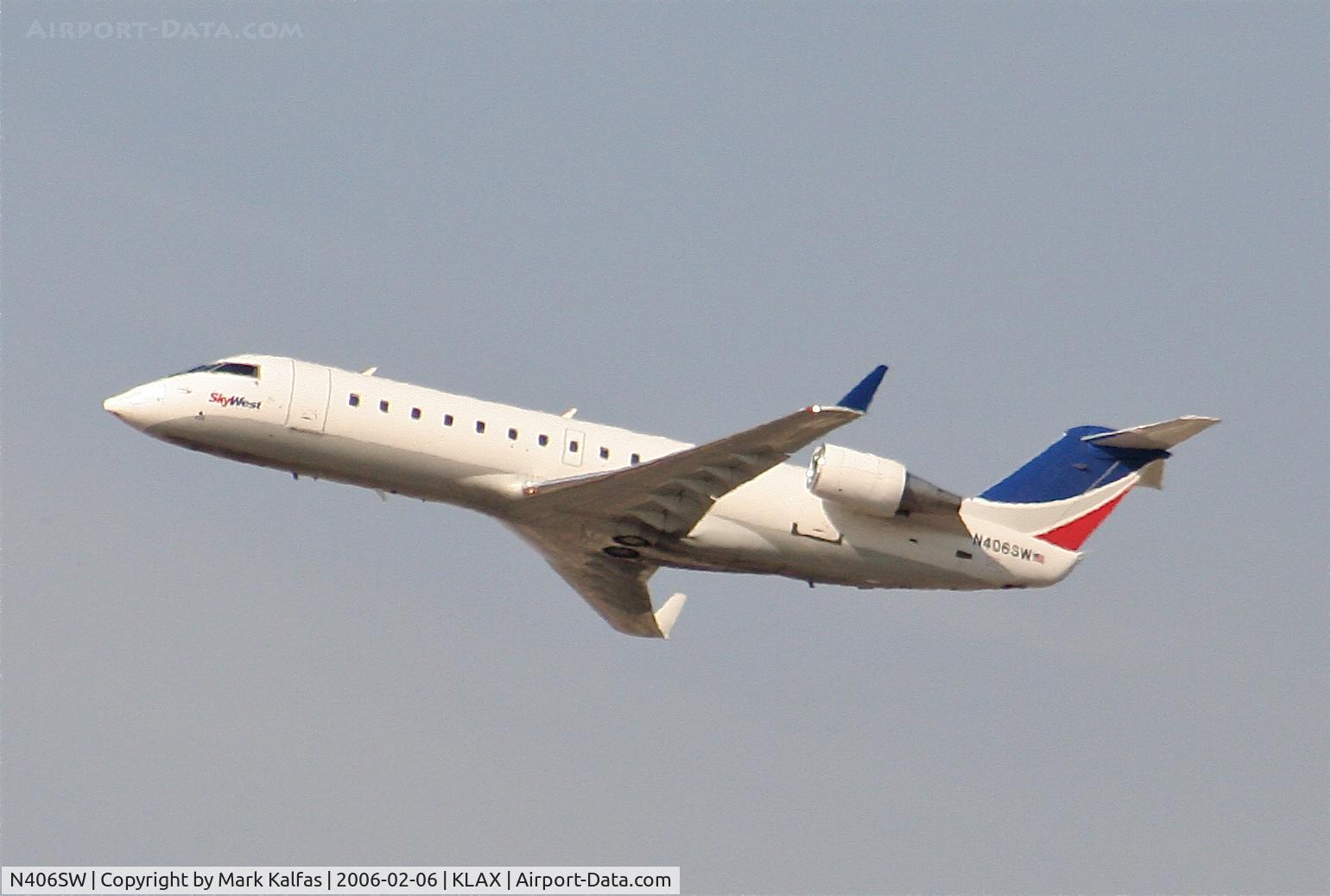 N406SW, 1993 Canadair CRJ-100LR (CL-600-2B19) C/N 7030, SkyWest Bombardier CL-600-2B19, N406SW departing 25R KLAX.