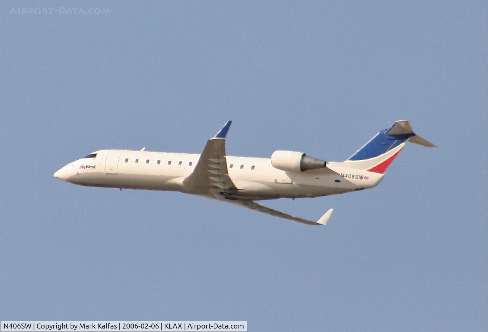 N406SW, 1993 Canadair CRJ-100LR (CL-600-2B19) C/N 7030, SkyWest Bombardier CL-600-2B19, N406SW departing 25R KLAX.