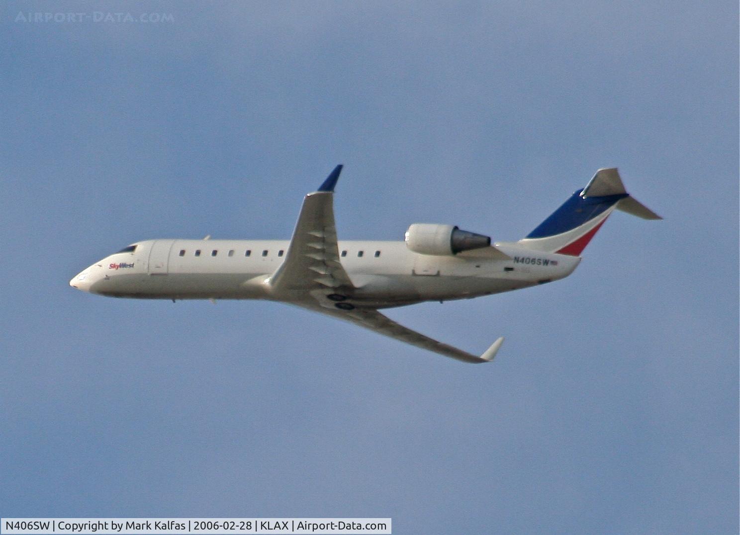 N406SW, 1993 Canadair CRJ-100LR (CL-600-2B19) C/N 7030, SkyWest Bombardier CL-600-2B19, N406SW departing 25R KLAX.