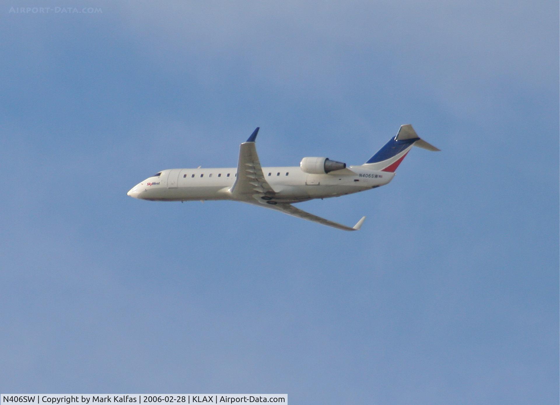 N406SW, 1993 Canadair CRJ-100LR (CL-600-2B19) C/N 7030, SkyWest Bombardier CL-600-2B19, N406SW departing 25R KLAX.