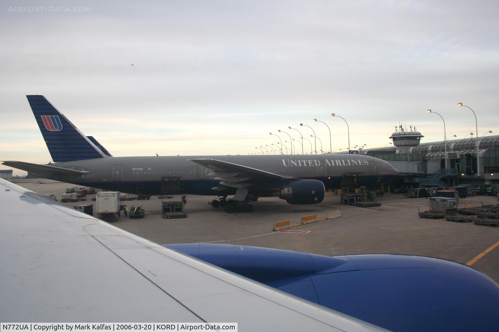 N772UA, 1995 Boeing 777-222 C/N 26930, United Airlines Boeing 777-222, N772UA looking out at N773UA at C16 KORD.