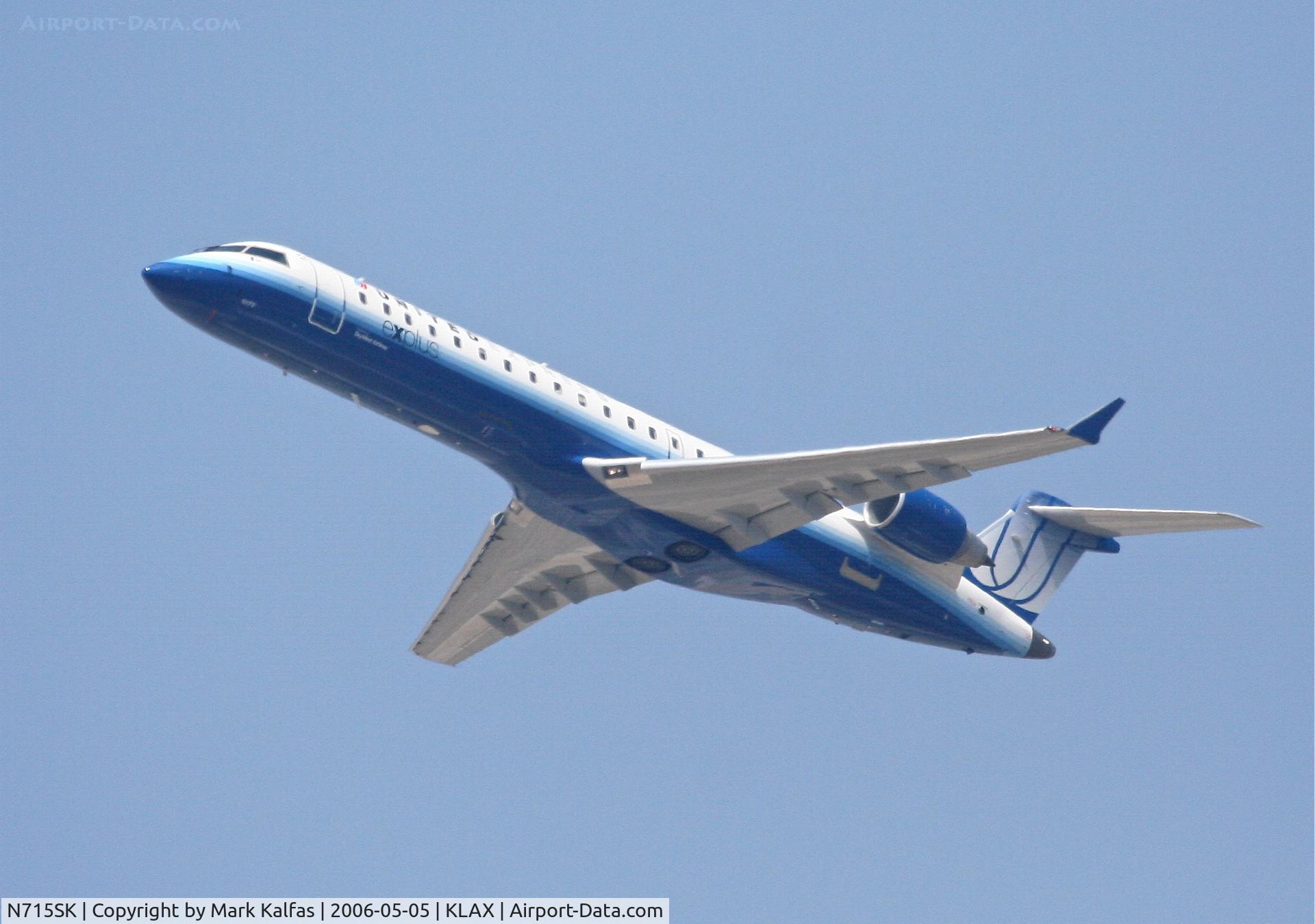 N715SK, 2004 Bombardier CRJ-700 (CL-600-2C10) Regional Jet C/N 10179, SkyWest Bombardier CL-600-2C10,  N715SK departing 25R KLAX.