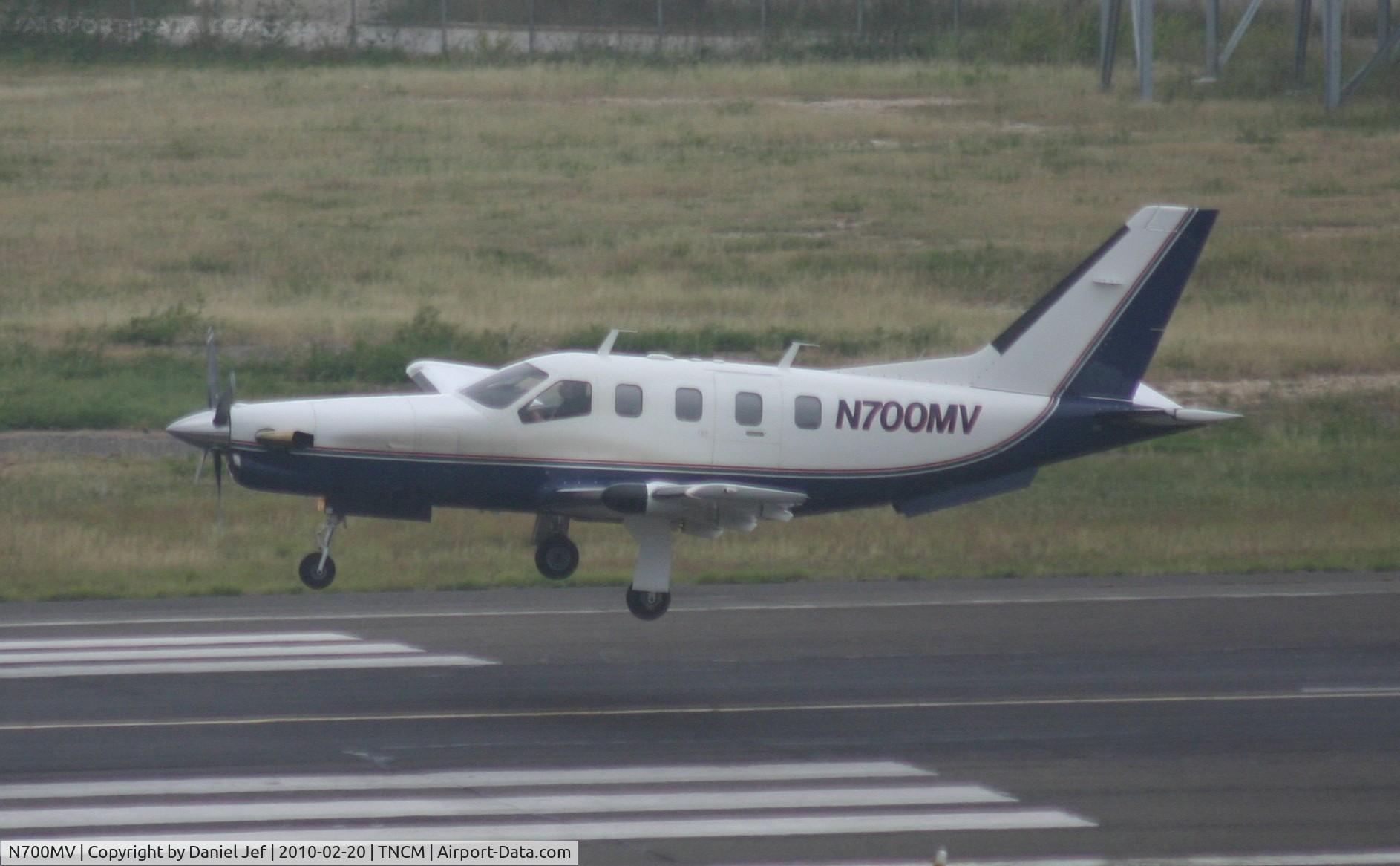 N700MV, 1991 Socata TBM-700 C/N 13, N700MV landing at TNCM in the rain