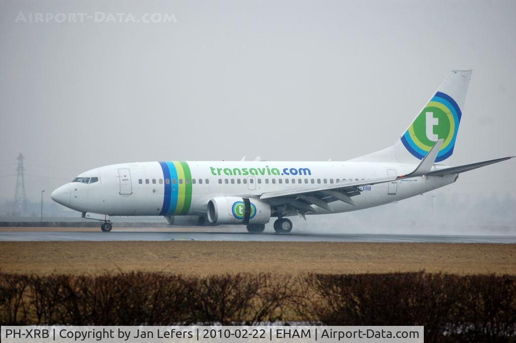 PH-XRB, 2003 Boeing 737-7K2 C/N 28256, Transavia landing in heavy rain