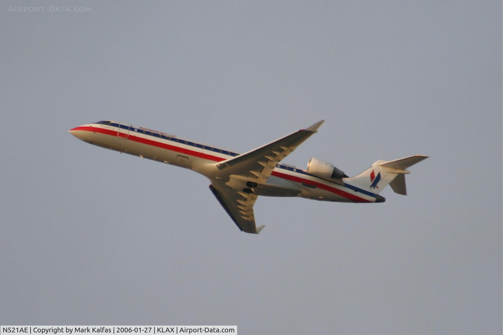 N521AE, 2004 Bombardier CRJ-701 (CL-600-2C10) Regional Jet C/N 10142, American Eagle Bombardier CL-600-2C10, N521AE 25R departure KLAX.