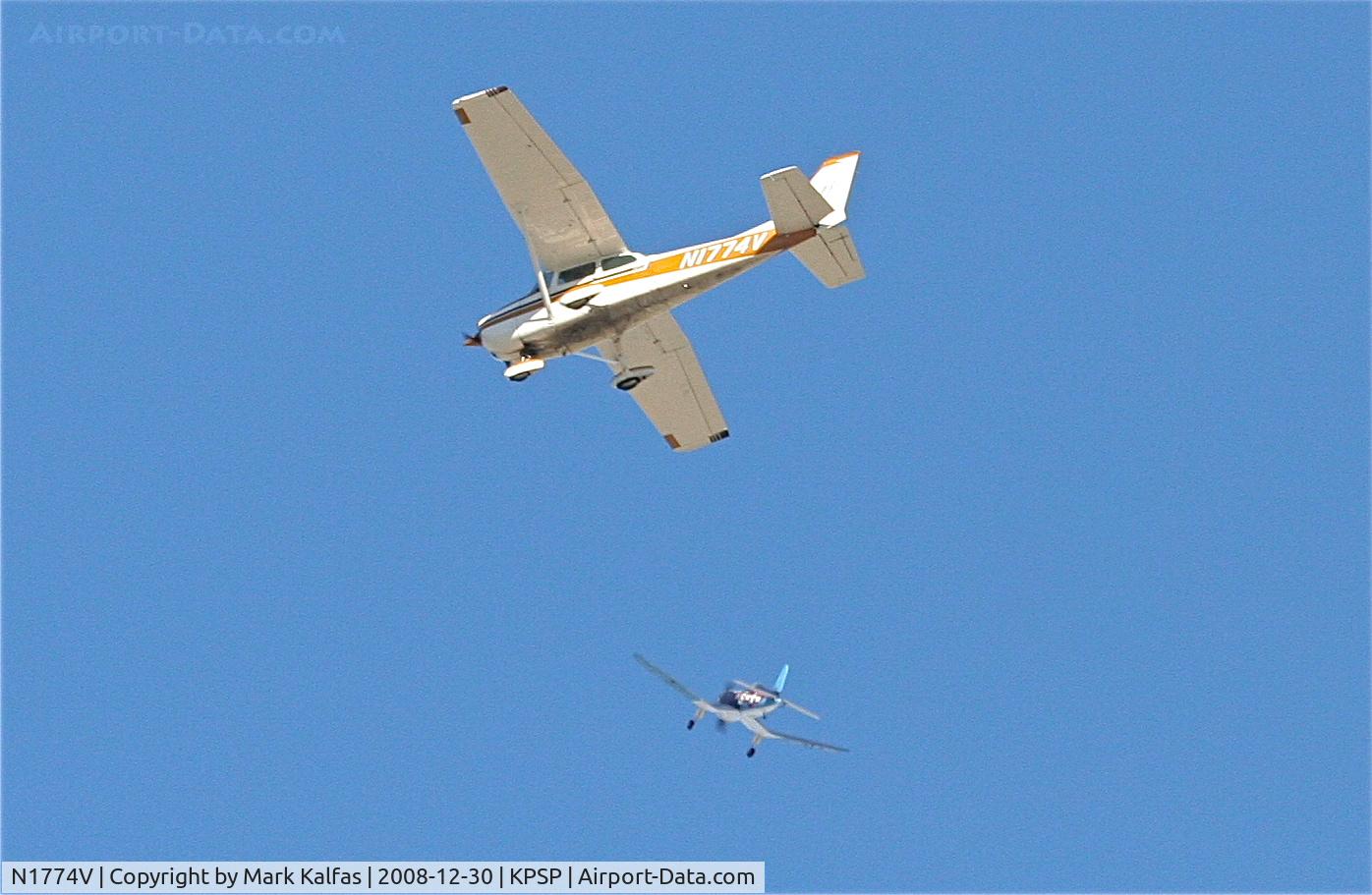 N1774V, 1974 Cessna 172M C/N 17263747, Cessna 172M N1774V on approach to KPSP flying over a RC park.