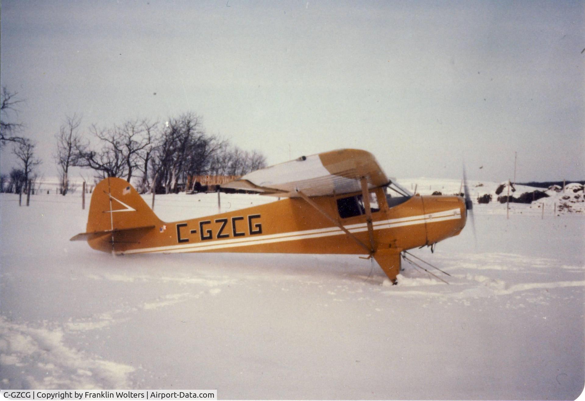 C-GZCG, 1946 Taylorcraft BC-12D C/N 9301, Winter photo of C-GZCG on skis
