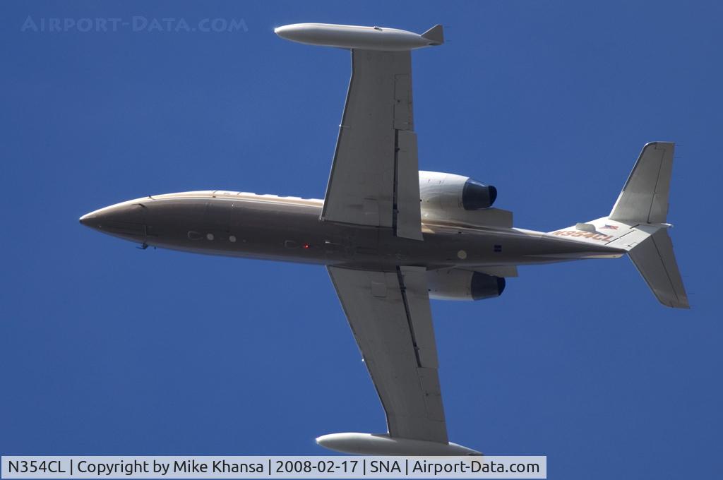N354CL, 1982 Gates Learjet 35A C/N 493, Gates Learjet 35A passing overhead.