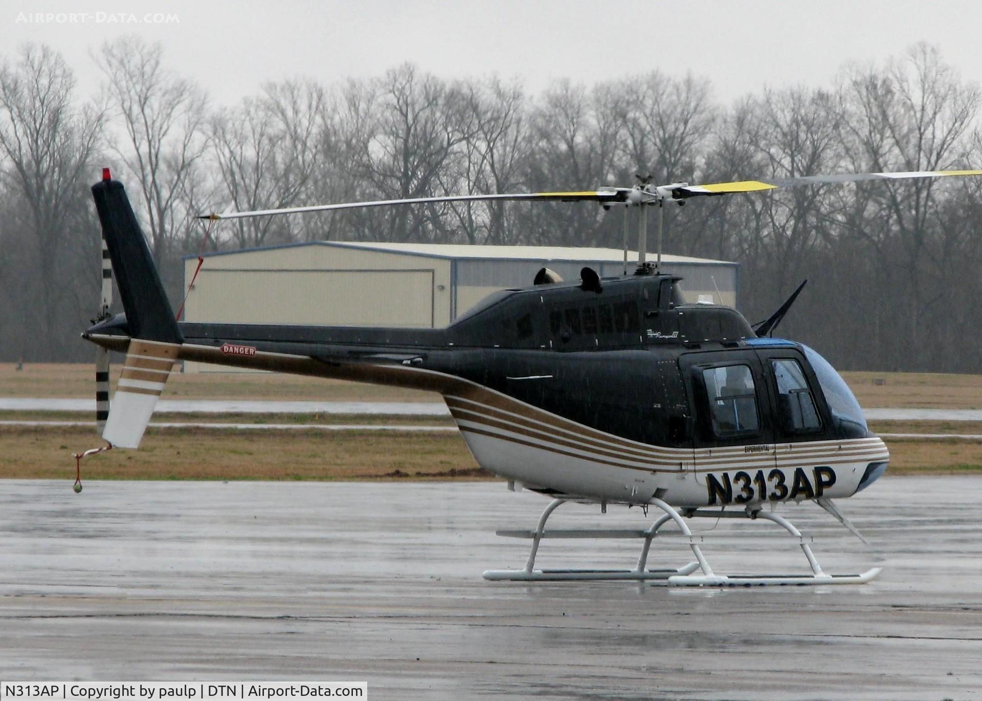 N313AP, 1981 Bell 206B JetRanger C/N 3471, Parked at Shreveport's Downtown Airport on a nasty, rainy day. This aircraft belongs to Andy Petree Inc. who bought it from Nascar driver Greg Biffle. Not sure why it would be here in Shreveport?