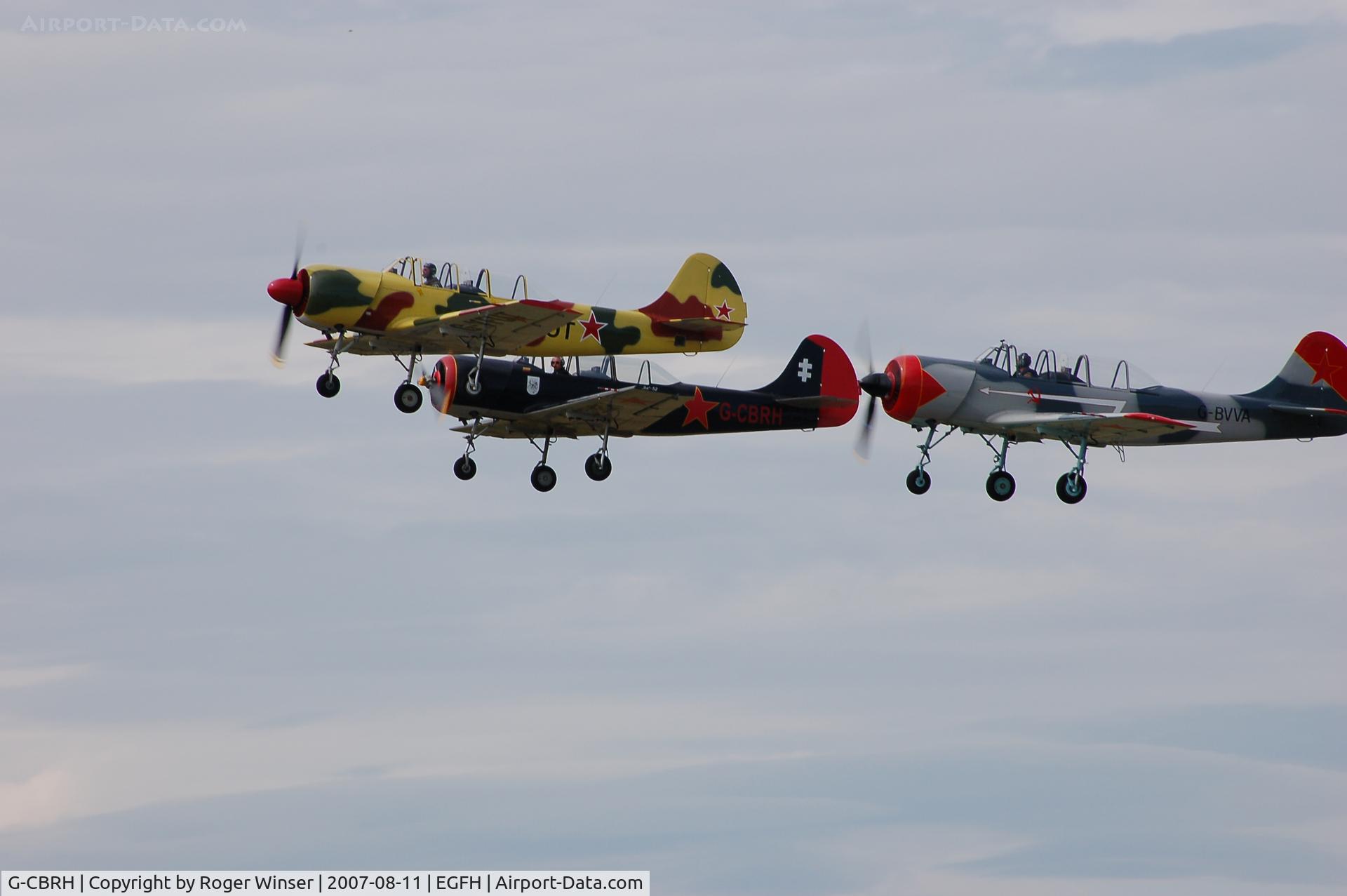 G-CBRH, 1984 Yakovlev Yak-52 C/N 844815, G-CBRH in a formation take off with G-BVVA and G-YFUT