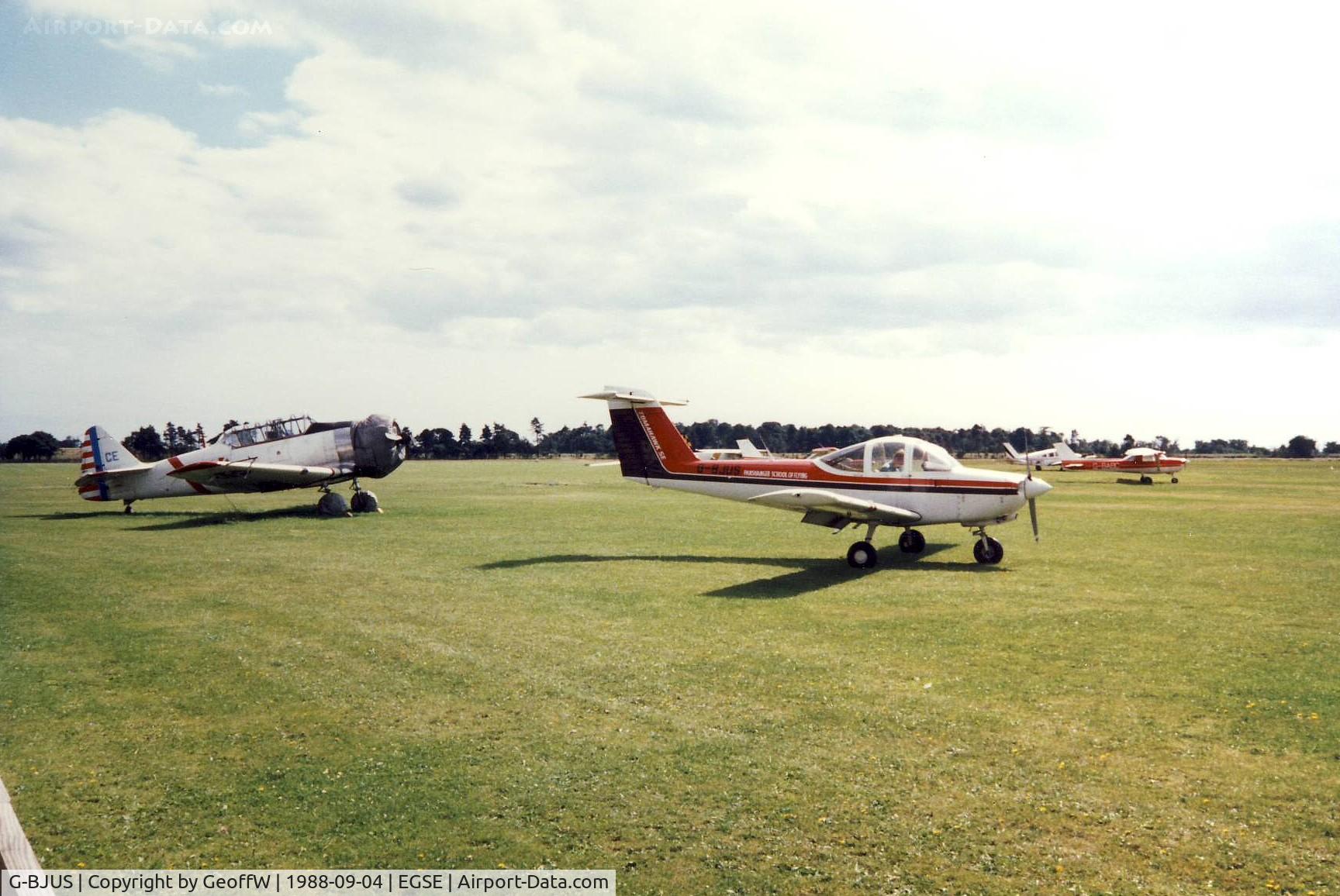 G-BJUS, 1980 Piper PA-38-112 Tomahawk Tomahawk C/N 38-80A0065, A visitor from The Panshanger School of Flying. Harvard G-BICE in the background.