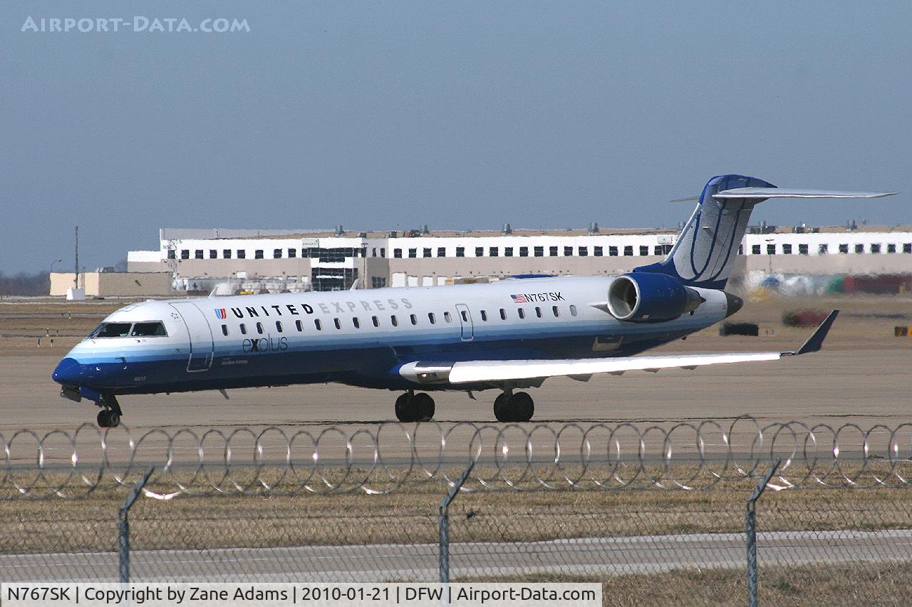N767SK, 2005 Bombardier CRJ-702 (CL-600-2C10) Regional Jet C/N 10233, United Express at DFW Airport