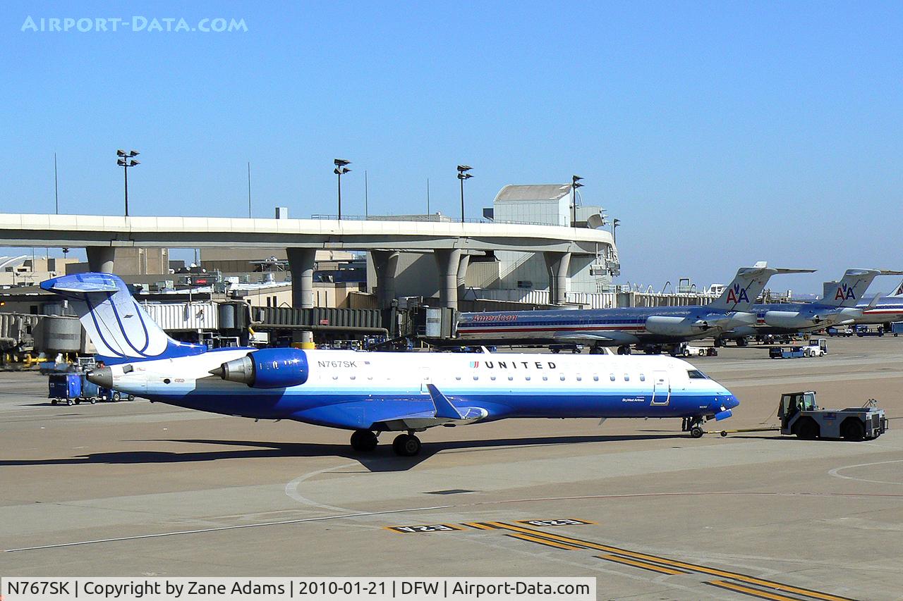 N767SK, 2005 Bombardier CRJ-702 (CL-600-2C10) Regional Jet C/N 10233, United Express at DFW Airport
