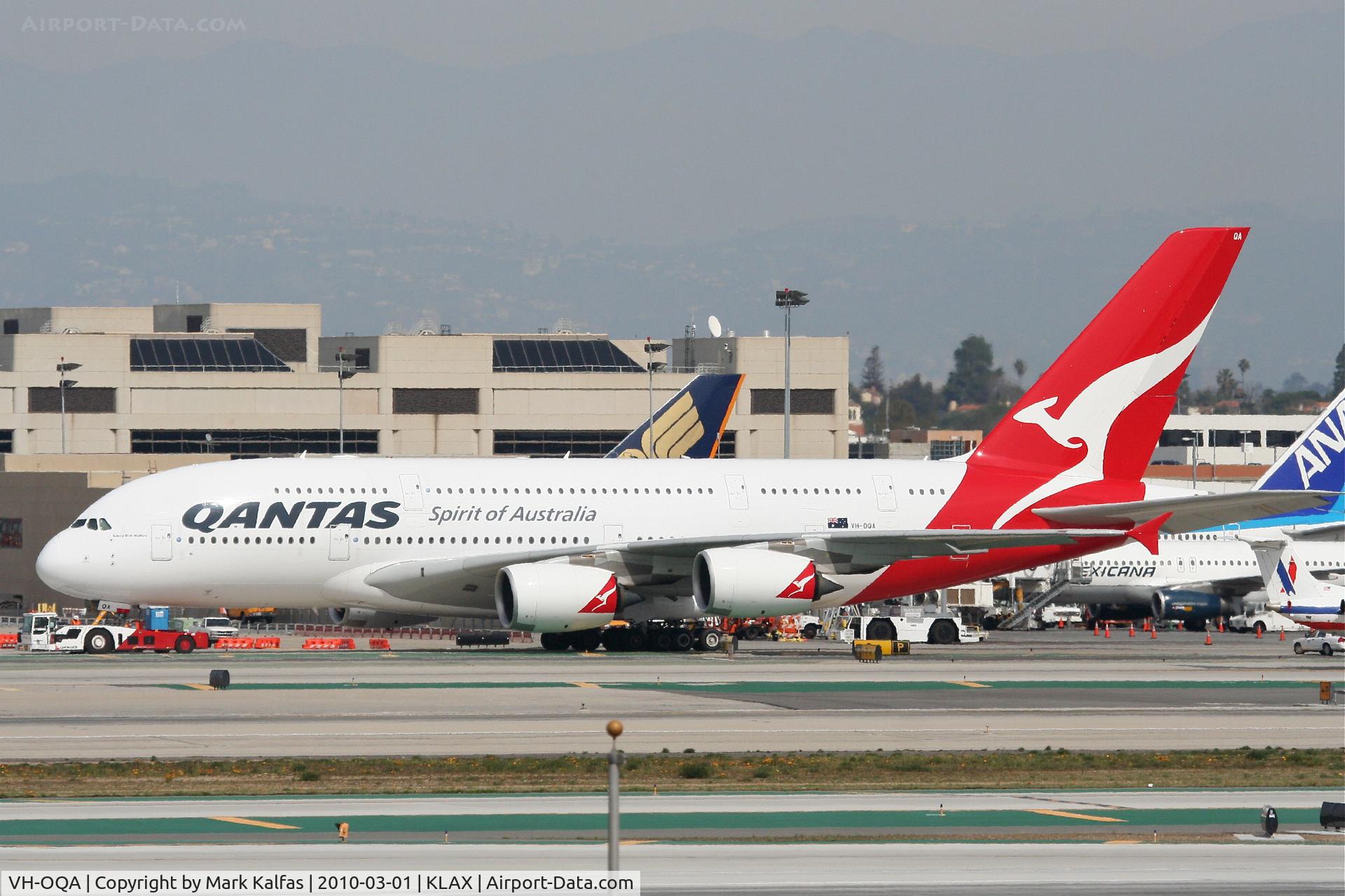 VH-OQA, 2008 Airbus A380-842 C/N 014, Qantas Airbus A380-842, VH-OQA, getting a tug to maintenance via taxiway Bravo after arriving from YSSY as QFA11.  .