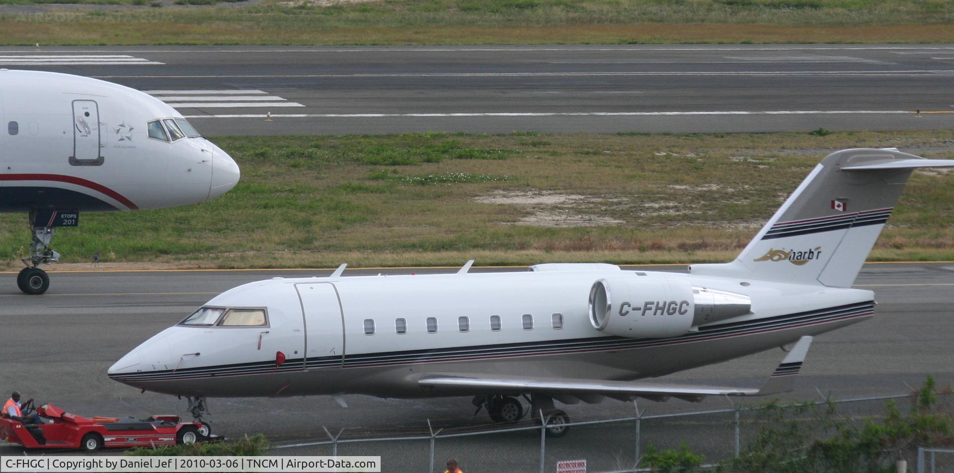 C-FHGC, Canadair Challenger 604 (CL-600-2B16) C/N 5453, C-FHGC BEING TOWED TO ITS PARKING POSITION AT THE CARGO RAMP.