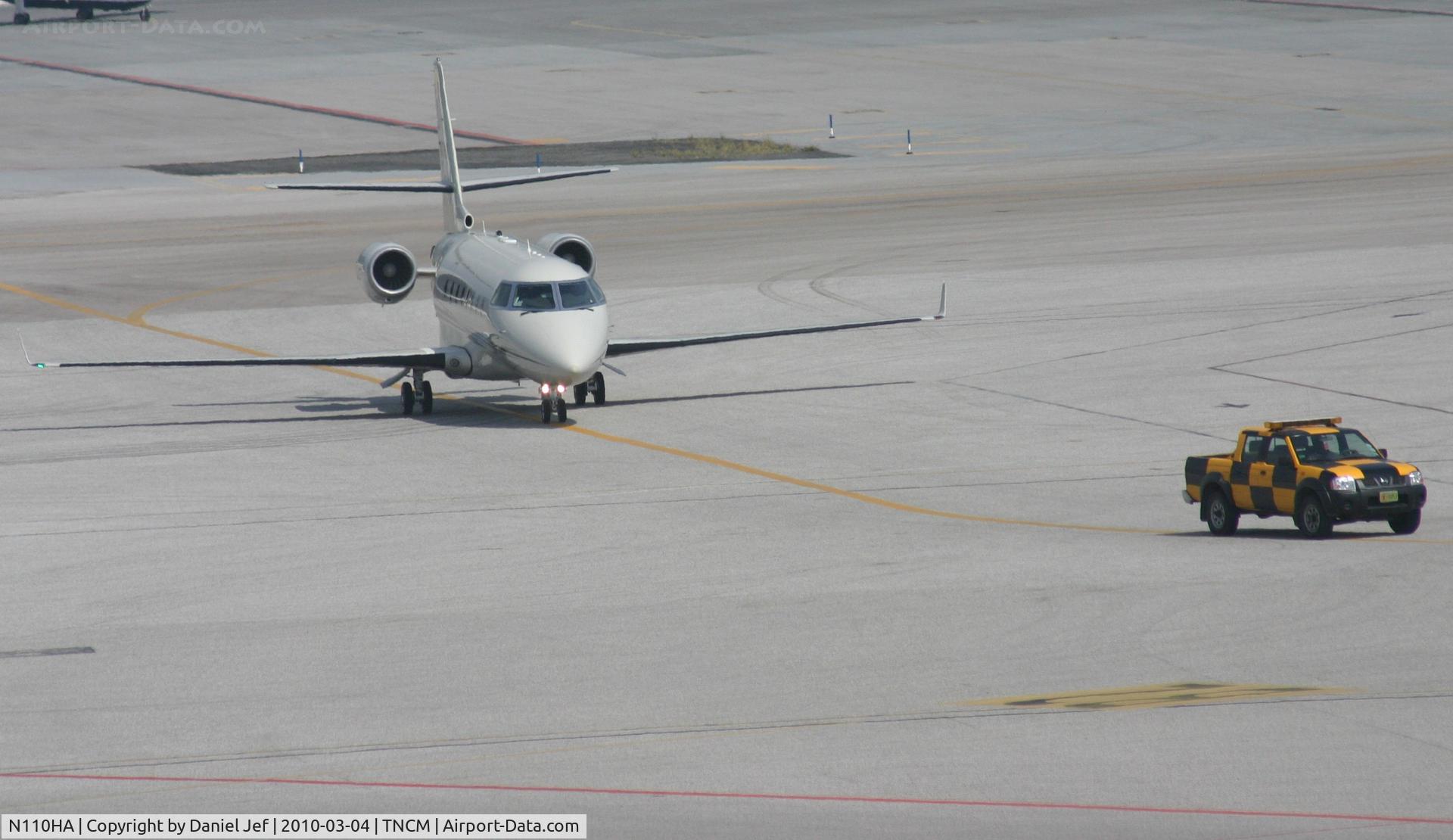 N110HA, 2001 Israel Aircraft Industries Gulfstream 200 C/N 035, N110HA taxing behind the follow me truck to parking at the cargo ramp