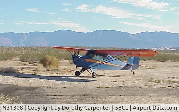 N31308, 1940 Aeronca 65-TC Tandem C/N L4750T, Bill Carpenter taxiing in after landing on dirt runway at Borrego Air Ranch