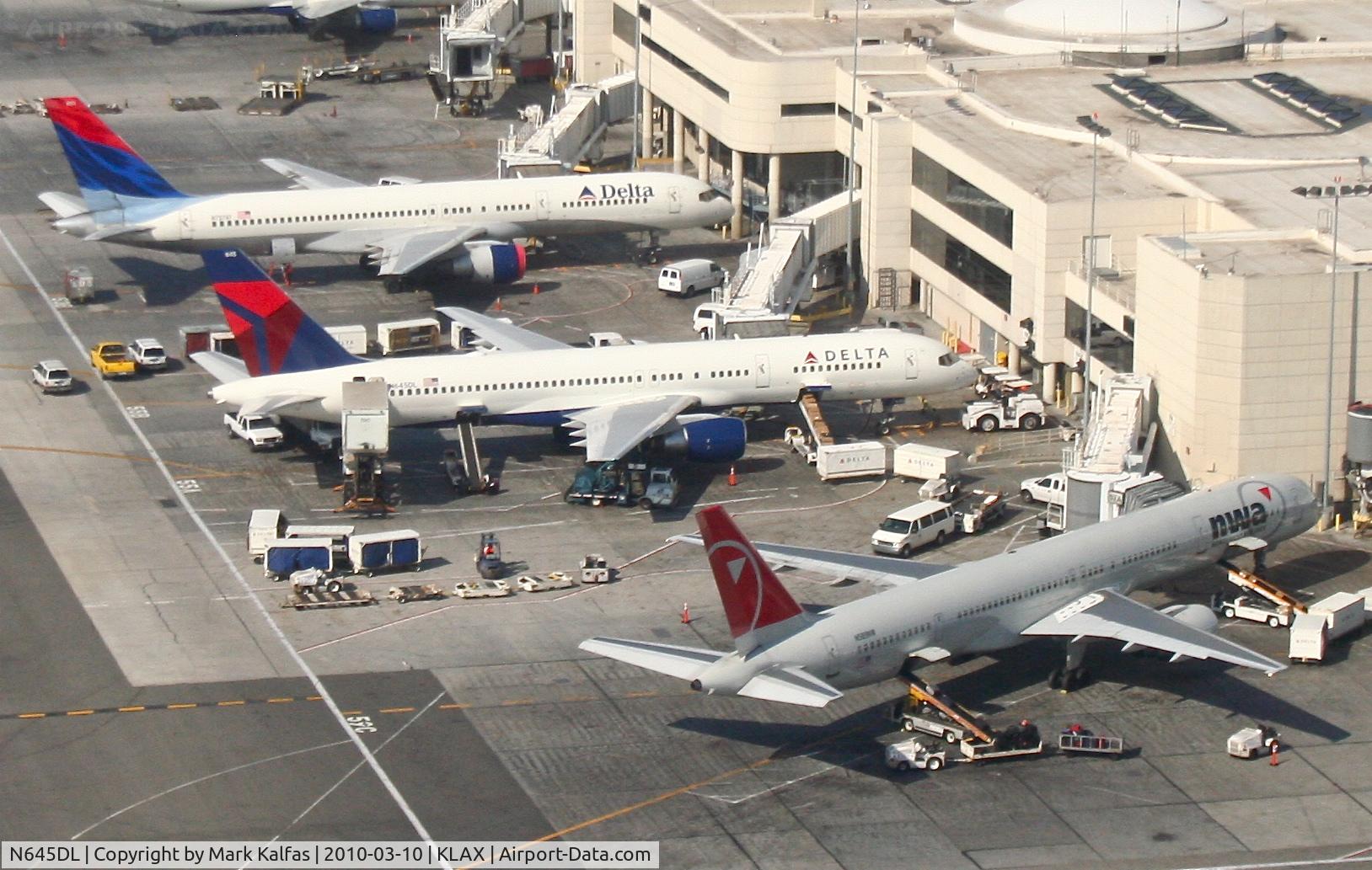 N645DL, 1989 Boeing 757-232 C/N 24216, Delta Airlines Boeing 757-232, N645DL (center) Terminal 5, Gate 55A KLAX.