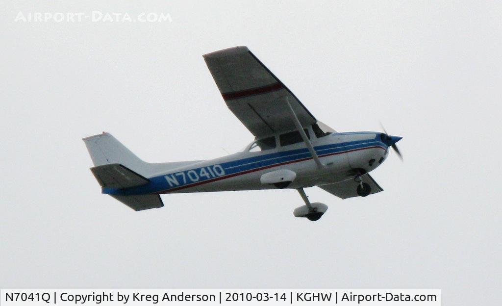 N7041Q, 1971 Cessna 172L C/N 17260341, Cessna 172L doing touch-n-goes on runway 33. Sorry for the backlit photo.