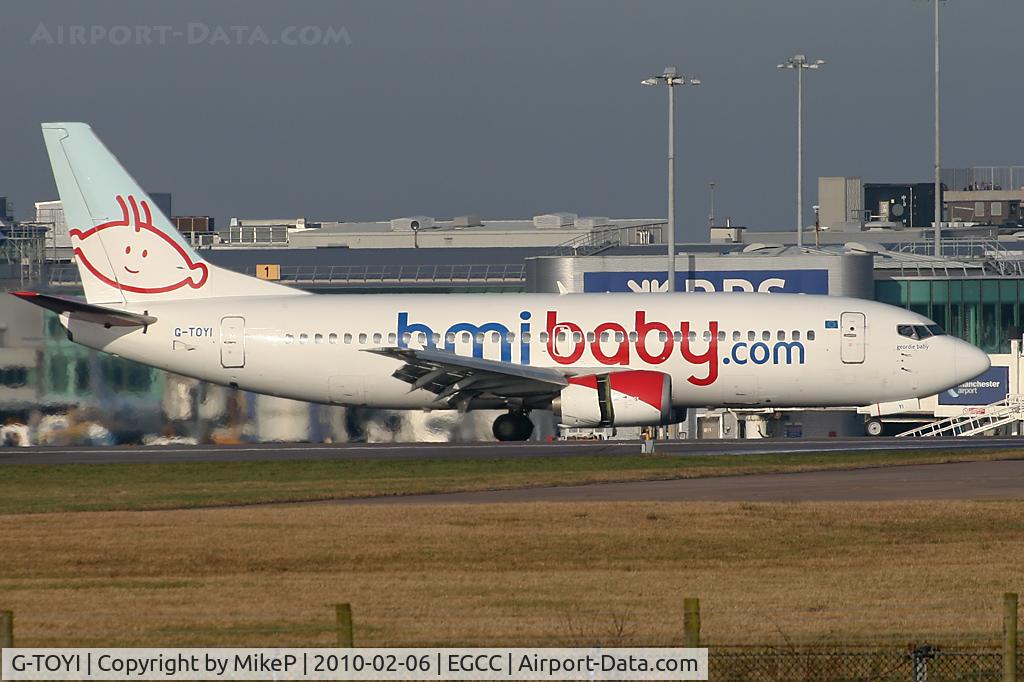 G-TOYI, 1998 Boeing 737-3Q8 C/N 28054, About to vacate 05L.