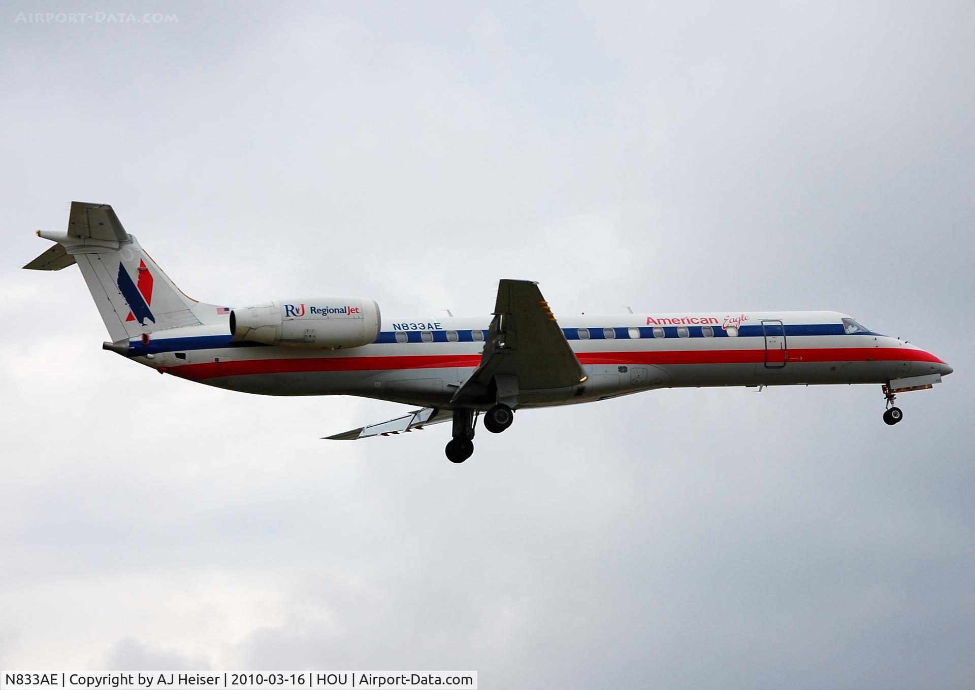 N833AE, 2002 Embraer ERJ-140LR (EMB-135KL) C/N 145629, Over the numbers rwy 12R