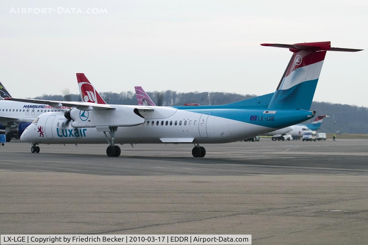 LX-LGE, 2009 De Havilland Canada DHC-8-402Q Dash 8 C/N 4284, taxying to the gate